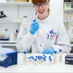 scientist smiling while using polycyps kit